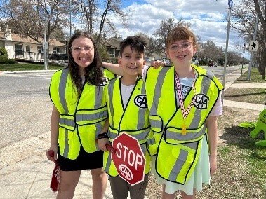 school zone patrollers hug